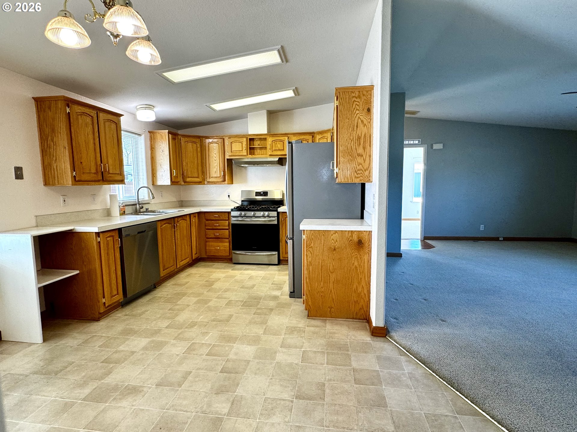 1070 Grove Street Baker City, OR 97814 - Photo 13 of 30 a view of kitchen with stainless steel appliances granite countertop cabinets and a refrigerator