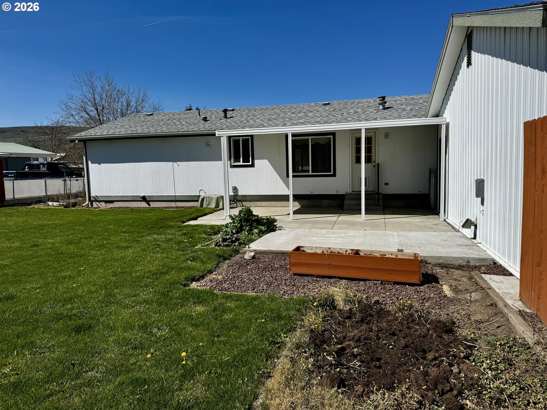1070 Grove Street Baker City, OR 97814 - Photo 18 of 30 a backyard of a house with yard fire pit and outdoor seating