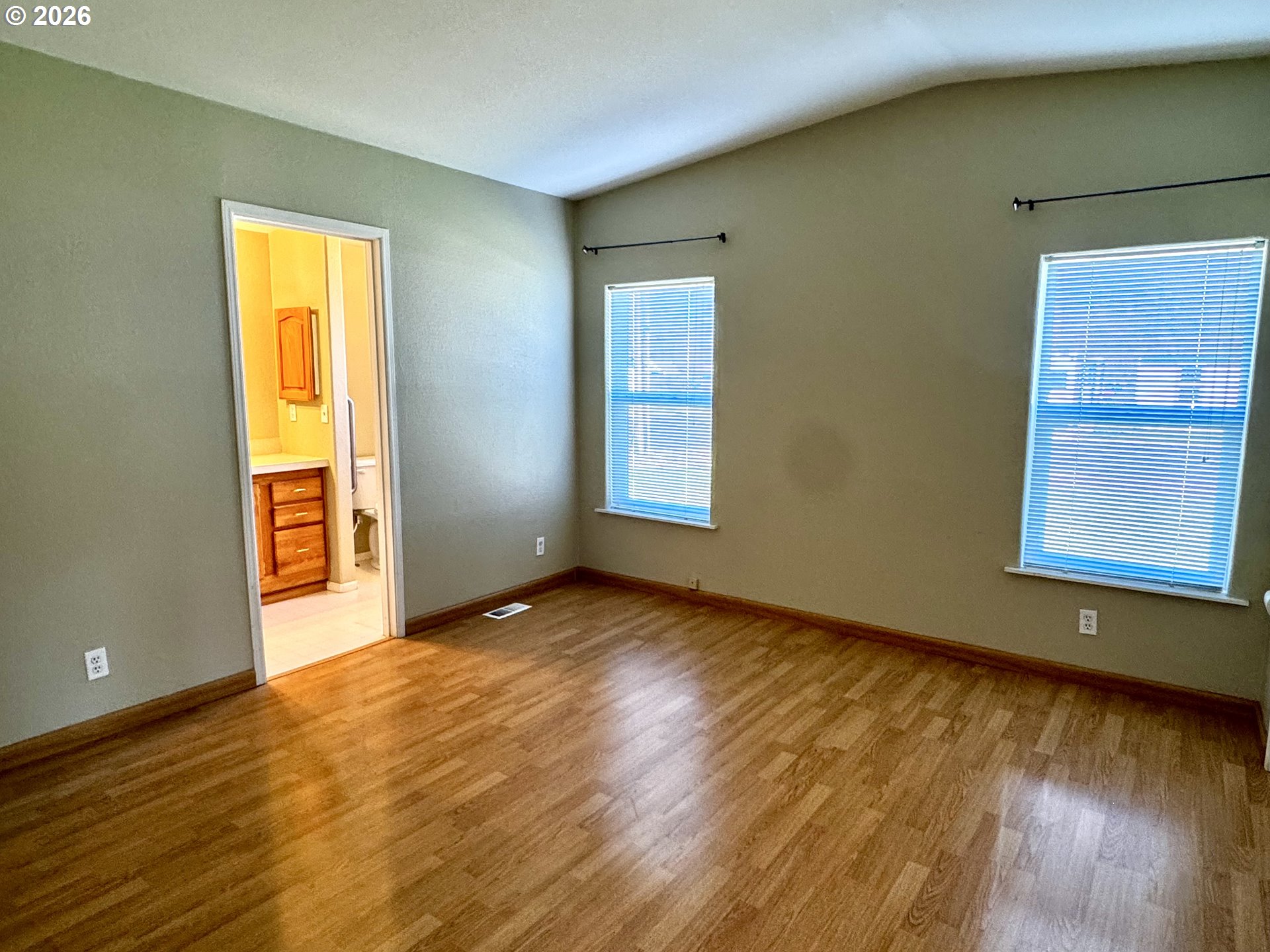 1070 Grove Street Baker City, OR 97814 - Photo 9 of 30 a view of an empty room with wooden floor and a window
