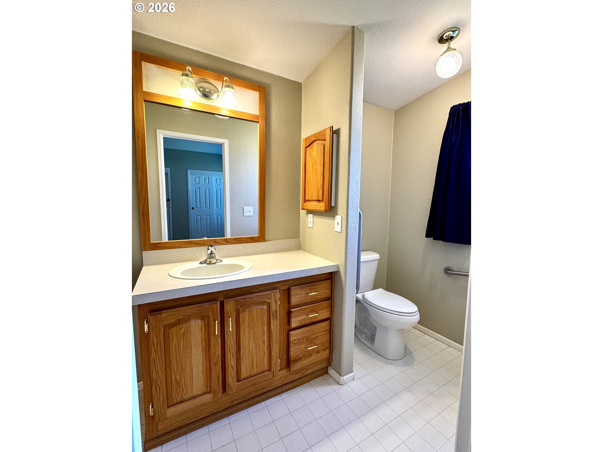 1070 Grove Street Baker City, OR 97814 - Photo 10 of 30 a bathroom with a sink and a mirror