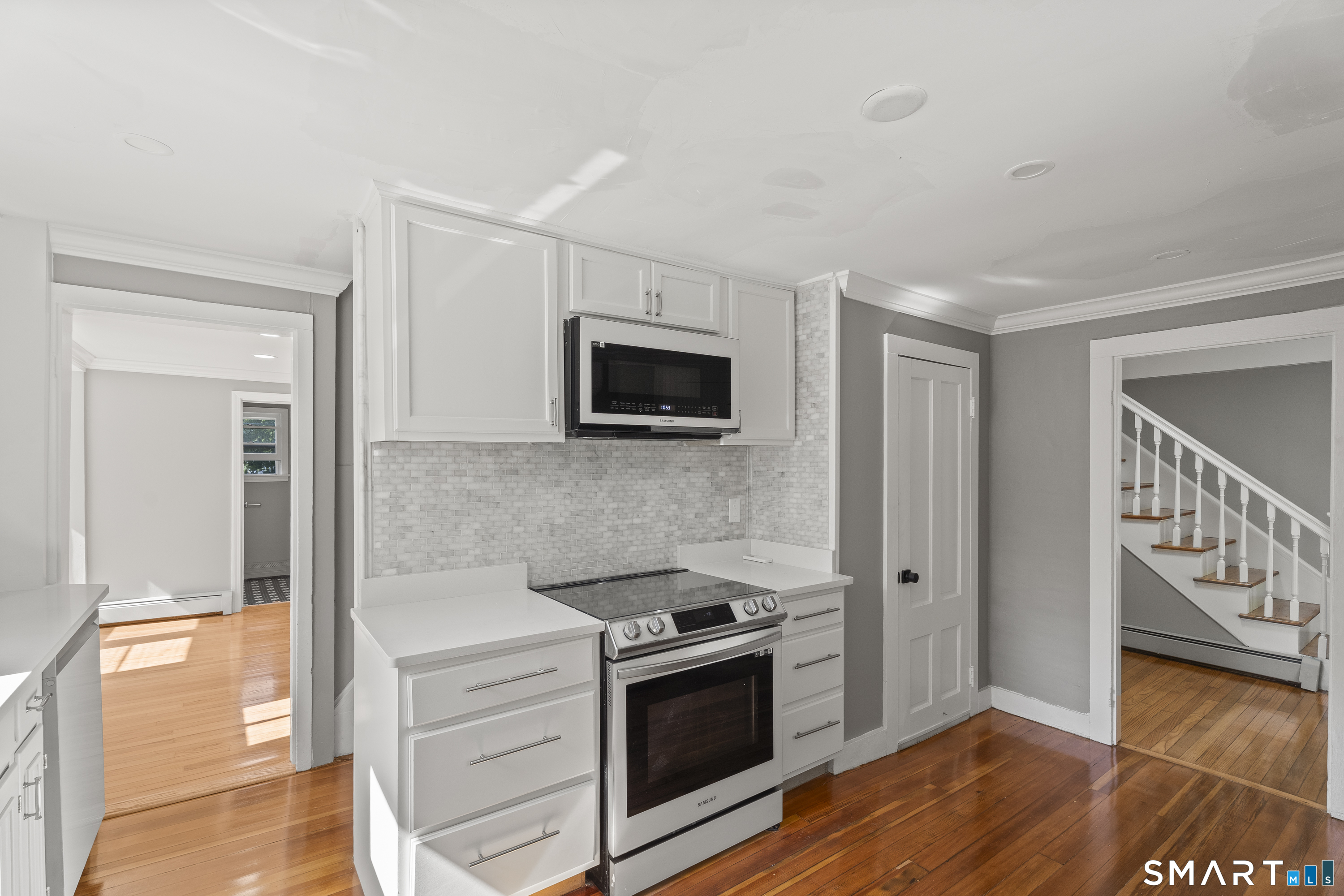 52 B Millstone Road West Waterford, CT 06385 - Photo 12 of 31 a kitchen with granite countertop a stove and a wooden floor