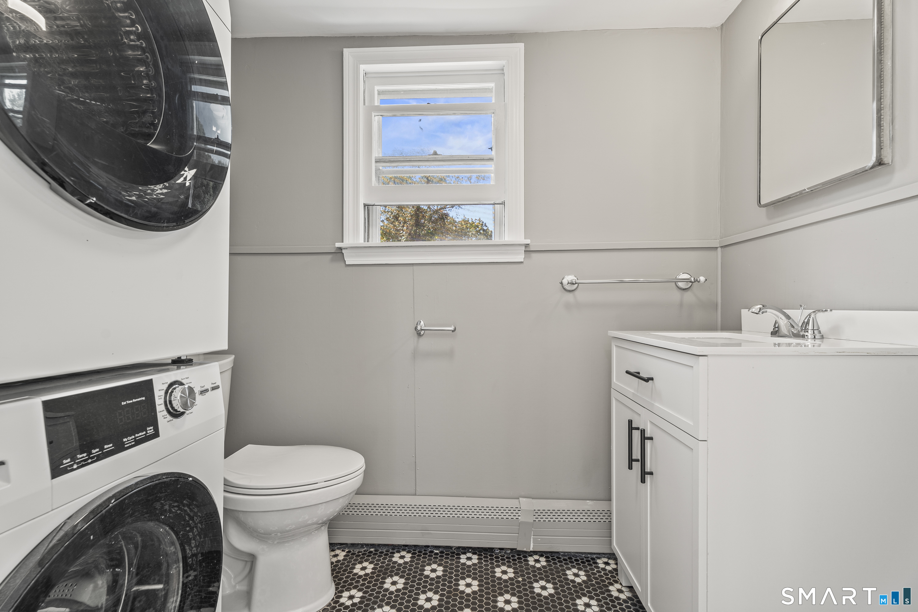 52 B Millstone Road West Waterford, CT 06385 - Photo 17 of 31 a bathroom with a sink a toilet and a mirror