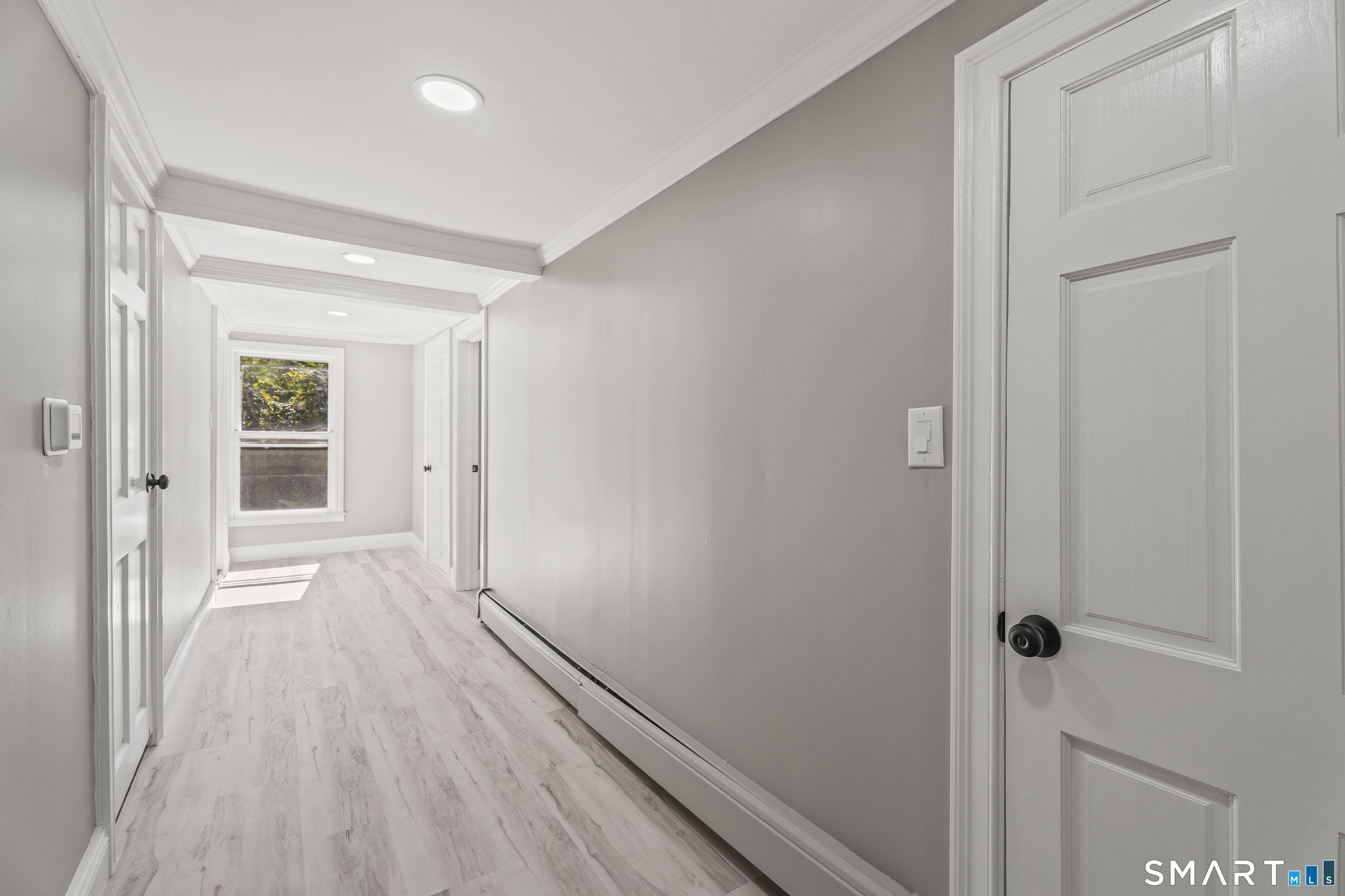 52 B Millstone Road West Waterford, CT 06385 - Photo 20 of 31 a view of a hallway with wooden floor