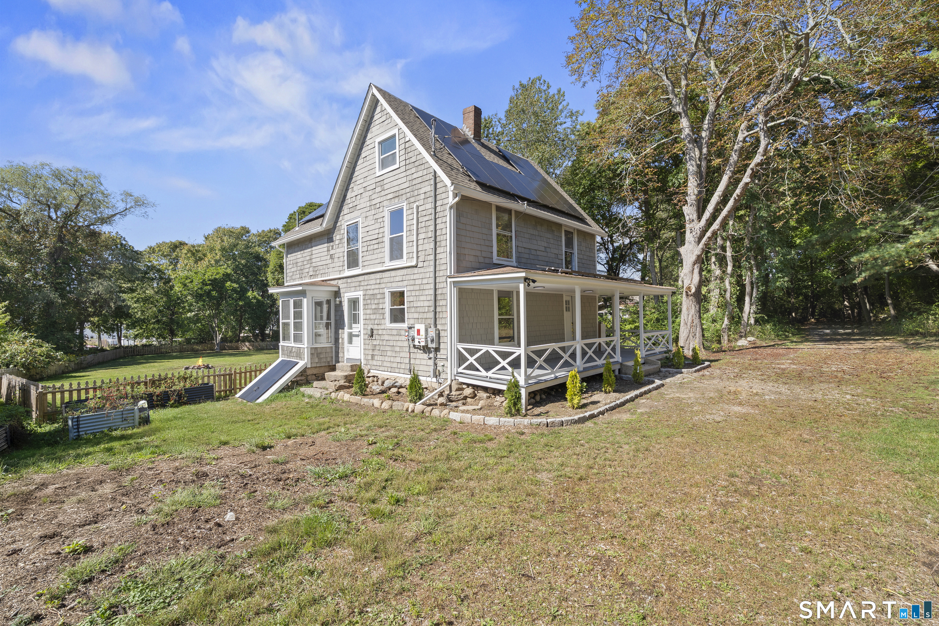 52 B Millstone Road West Waterford, CT 06385 - Photo 2 of 31 a view of a house with backyard and trees