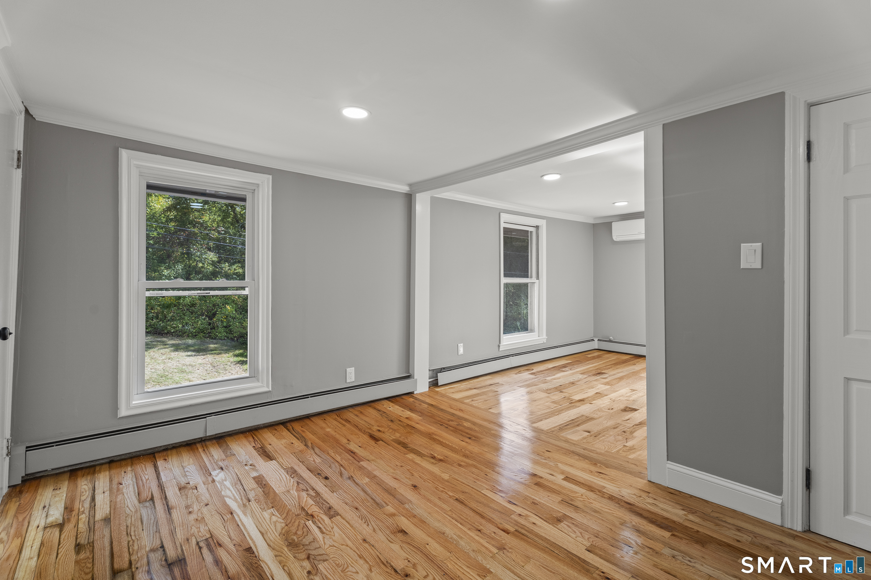 52 B Millstone Road West Waterford, CT 06385 - Photo 24 of 31 a view of an empty room with wooden floor and a window