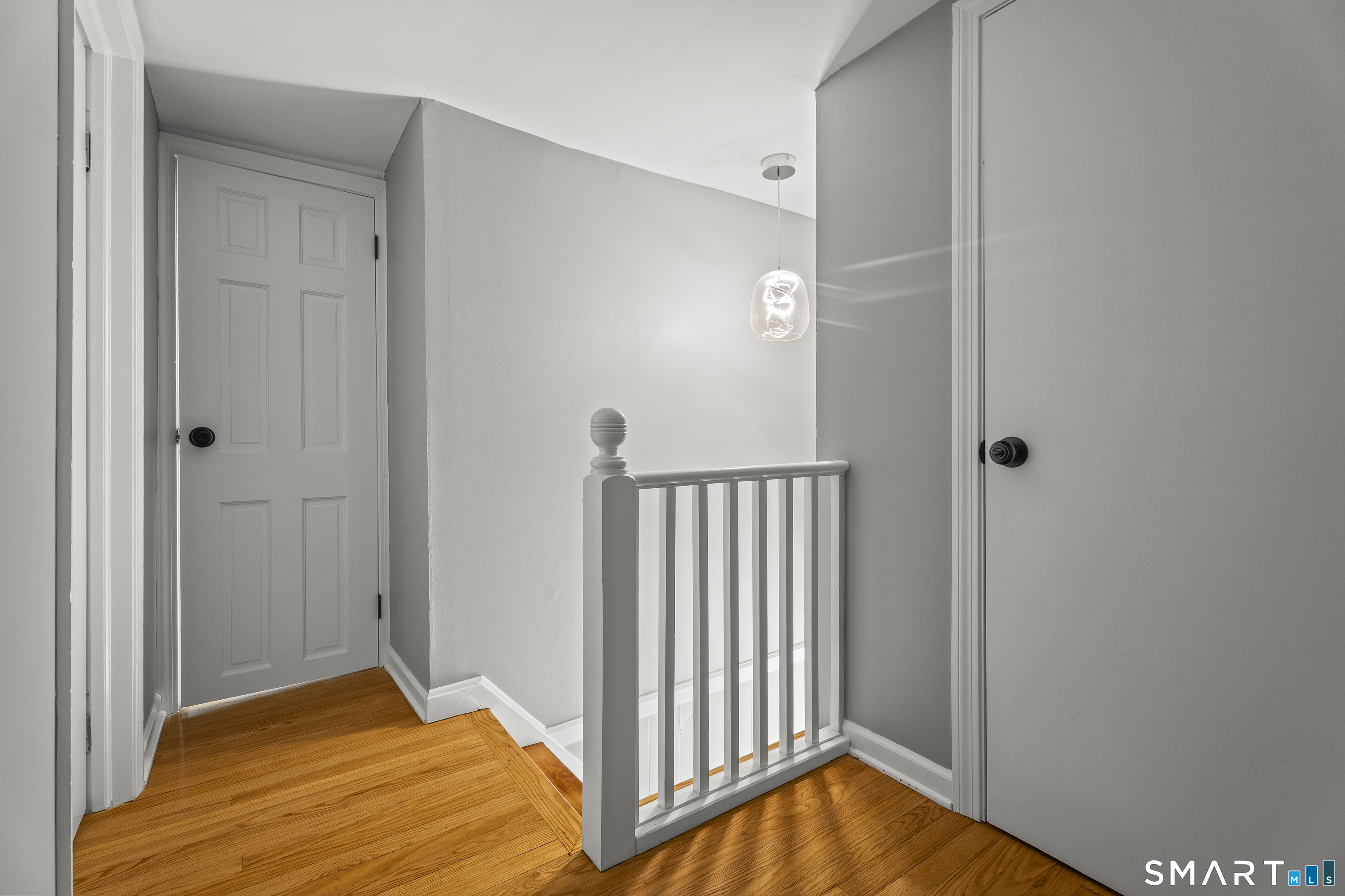 52 B Millstone Road West Waterford, CT 06385 - Photo 27 of 31 a bedroom with bed and wooden floor