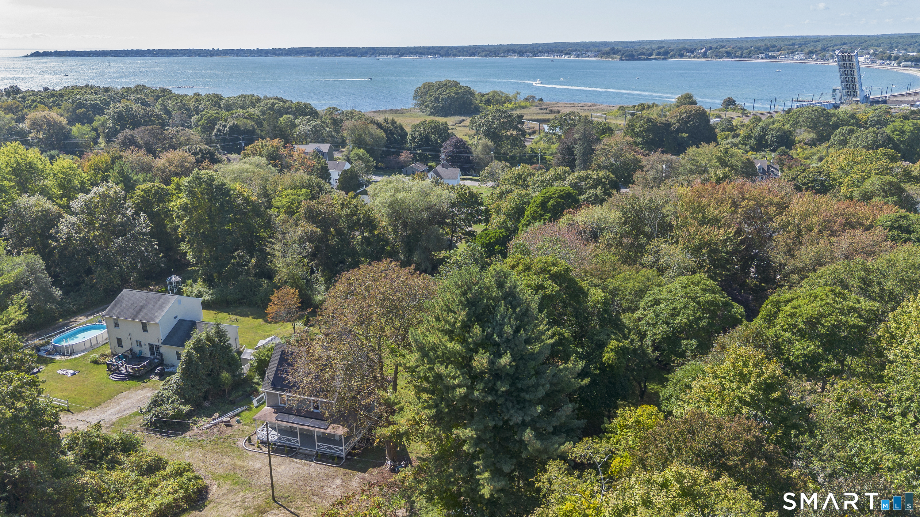 52 B Millstone Road West Waterford, CT 06385 - Photo 3 of 31 an aerial view of a city with lots of residential buildings ocean and mountain view in back