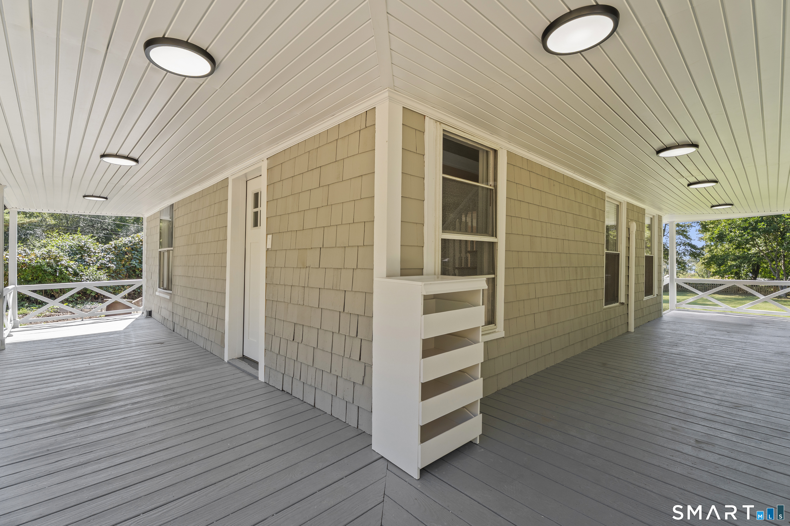 52 B Millstone Road West Waterford, CT 06385 - Photo 31 of 31 a view of a porch with wooden floor and fence