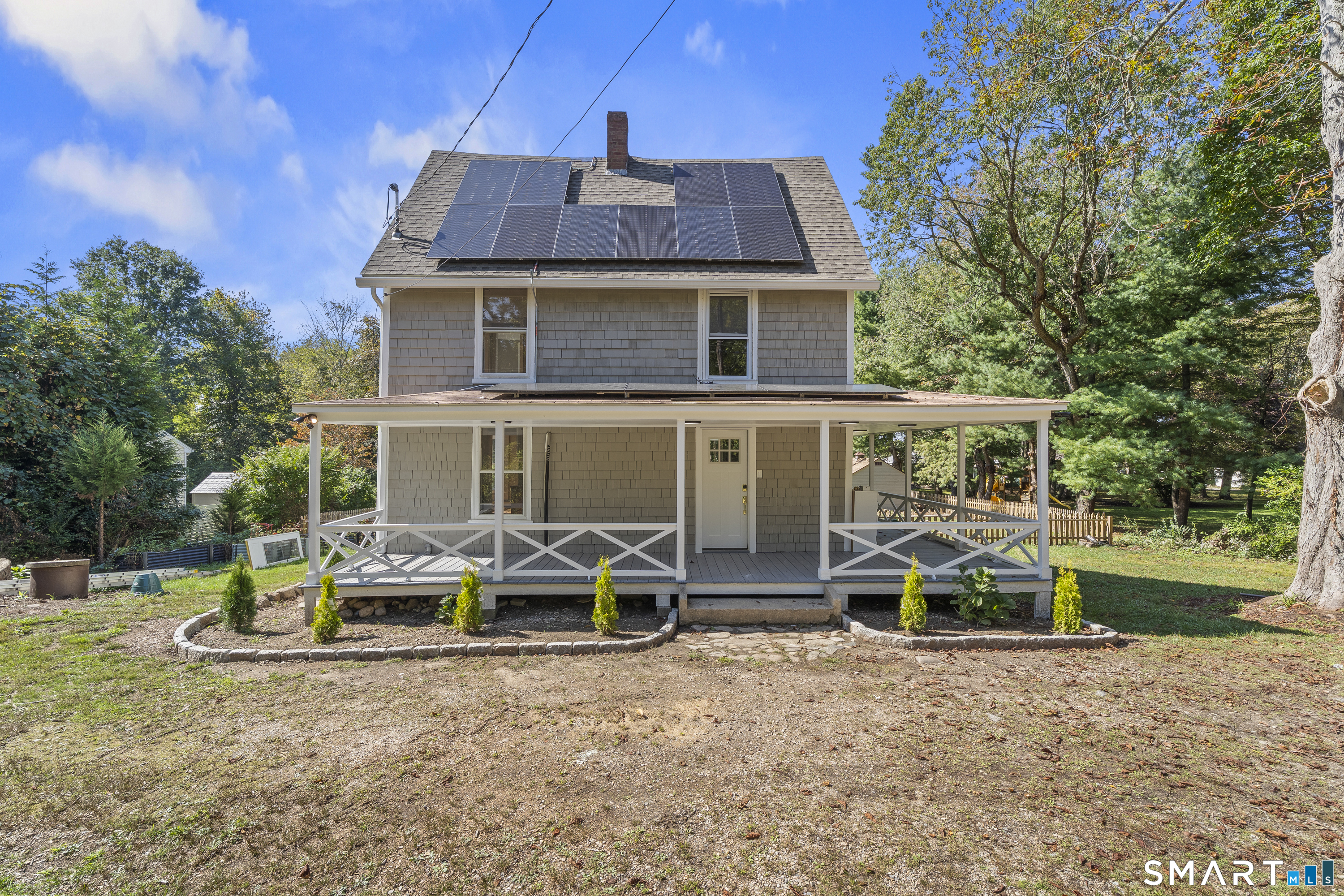 52 B Millstone Road West Waterford, CT 06385 - Photo 4 of 31 a aerial view of a house with table and chairs