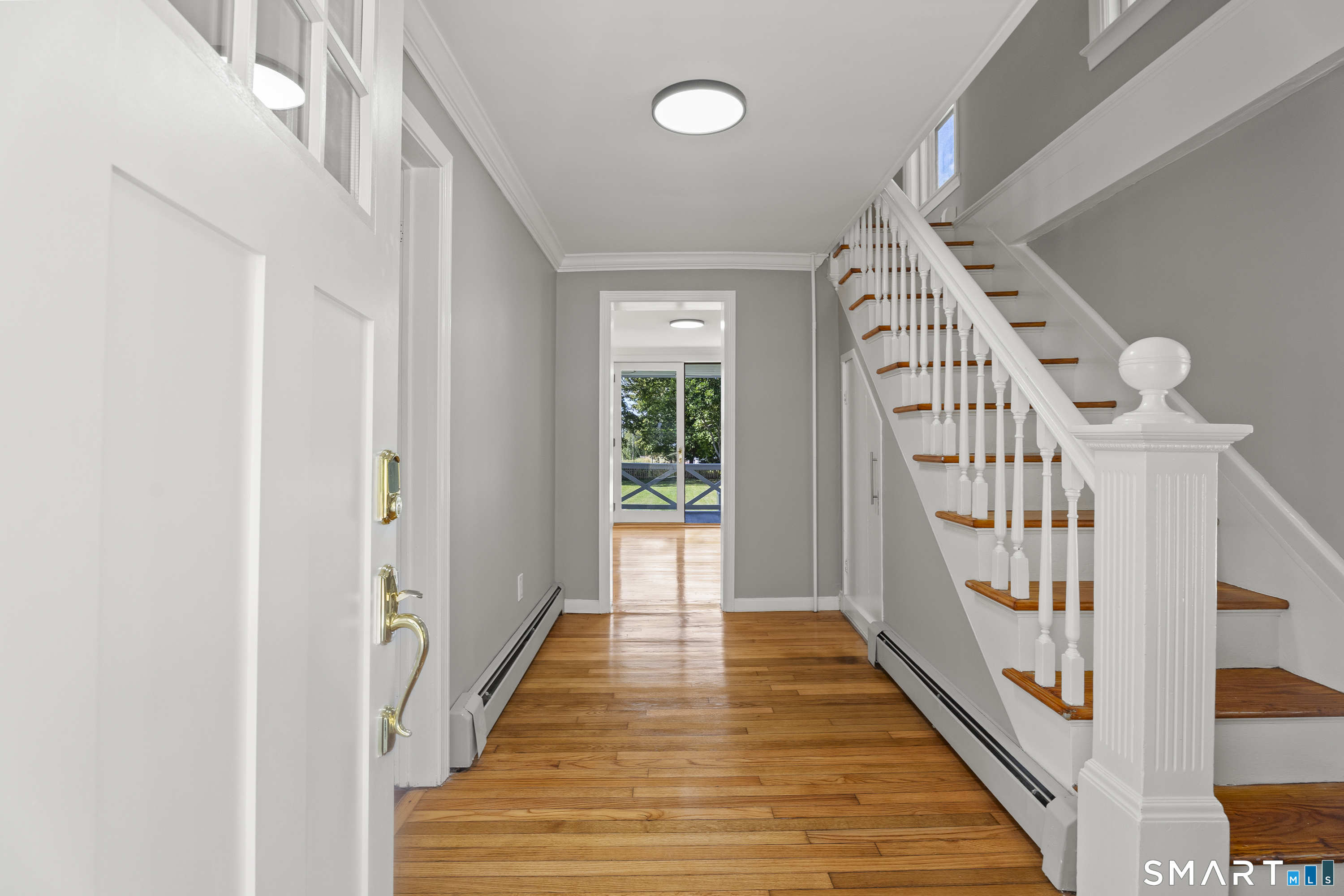 52 B Millstone Road West Waterford, CT 06385 - Photo 7 of 31 a view of a hallway with wooden floor and entryway