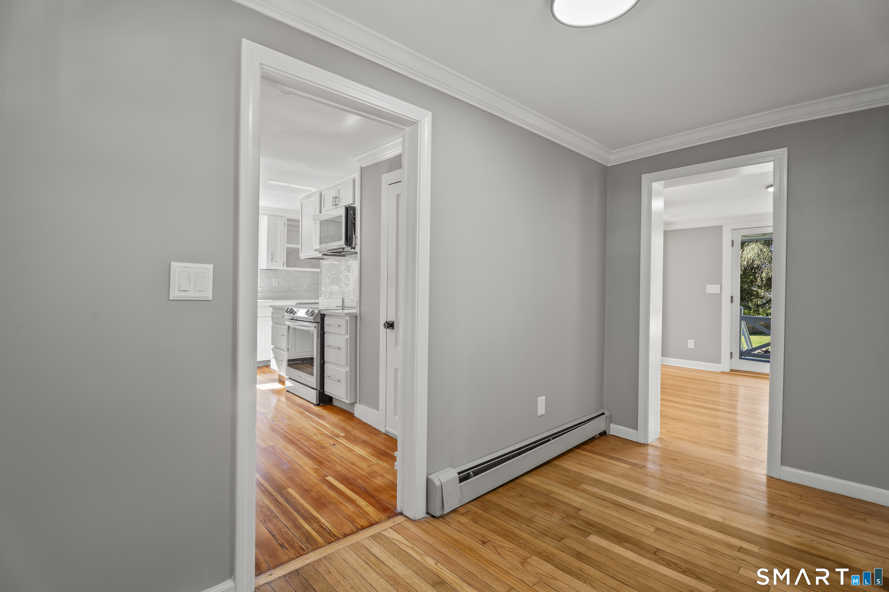 52 B Millstone Road West Waterford, CT 06385 - Photo 9 of 31 a view of a room with wooden floor and a bathroom