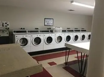 a kitchen with a stove and a refrigerator