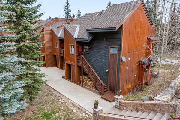 a view of a house with wooden stairs