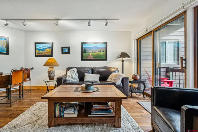 a living room with furniture and a table