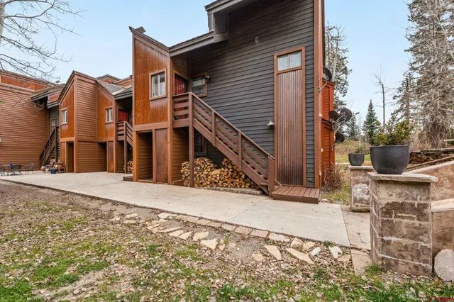 a view of a house with wooden fence