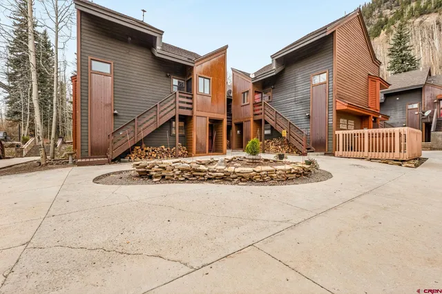 a view of a house with snow on the wall