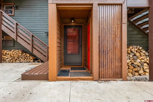 a hallway with sink and a refrigerator
