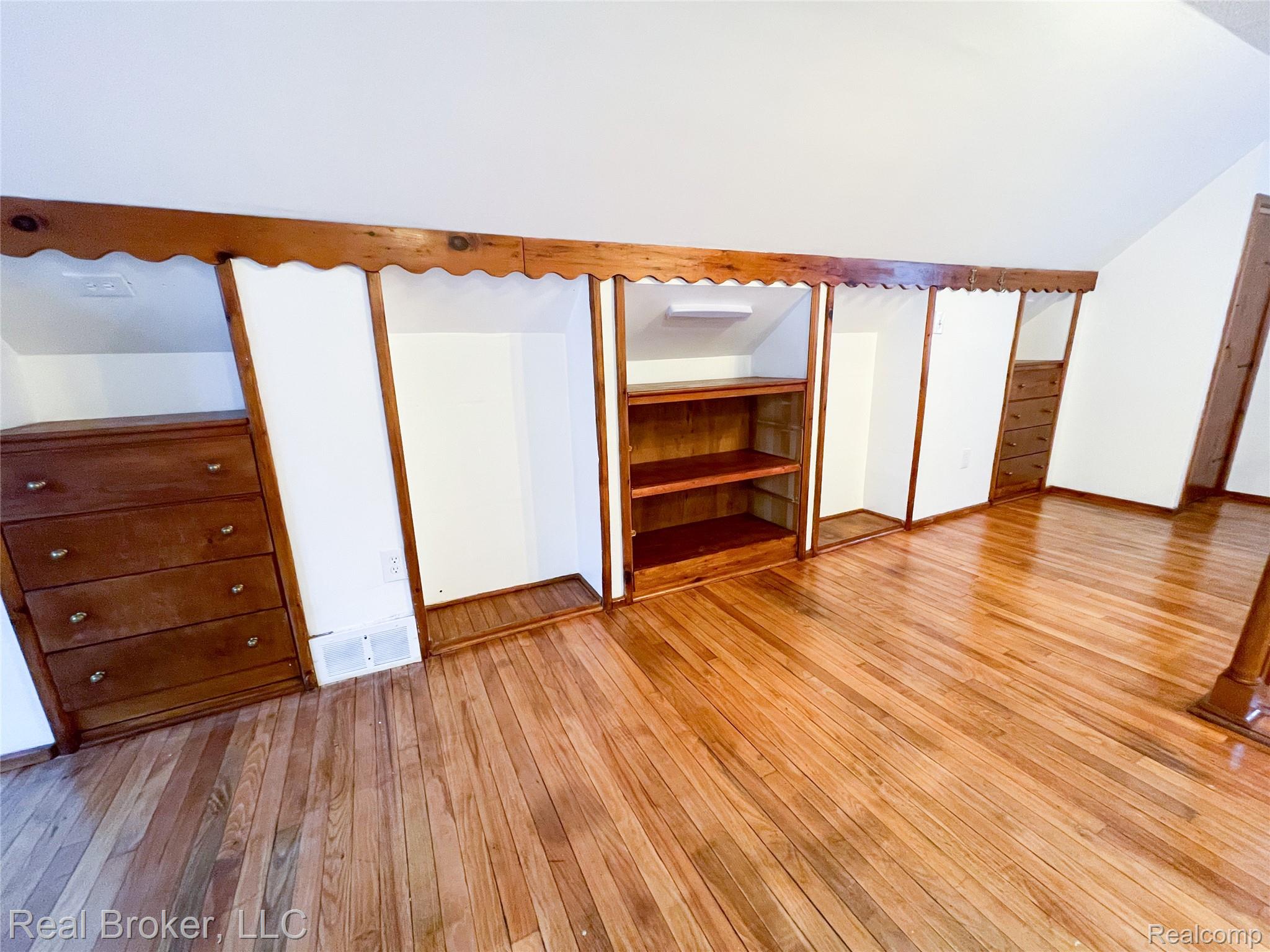 603 Vernier Road Grosse Pointe, MI 48236 - Photo 17 of 33 Unfurnished bedroom with light wood finished floors and vaulted ceiling