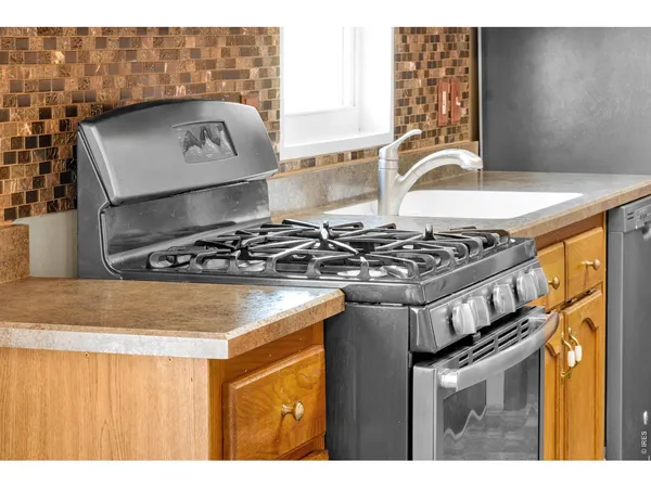 a kitchen with a stove and a cabinet