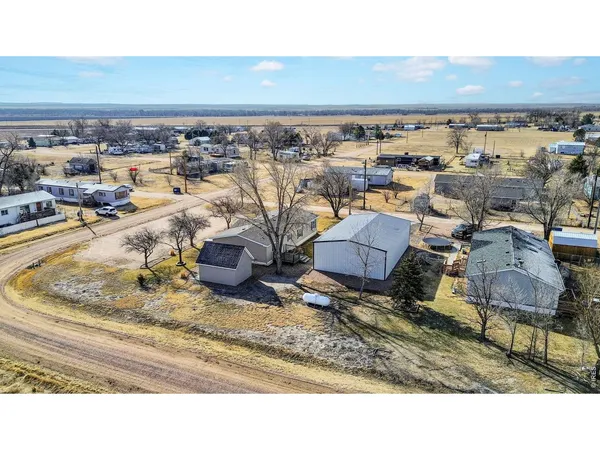a aerial view of a house with a yard