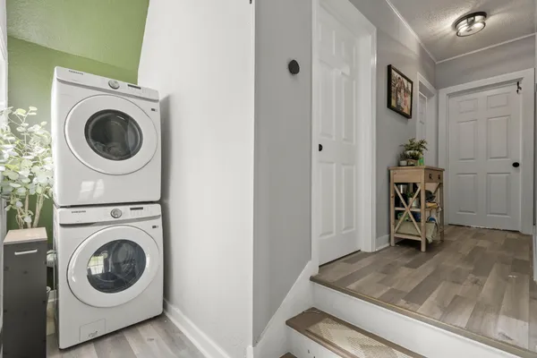 a view of a storage and utility room with washer and dryer