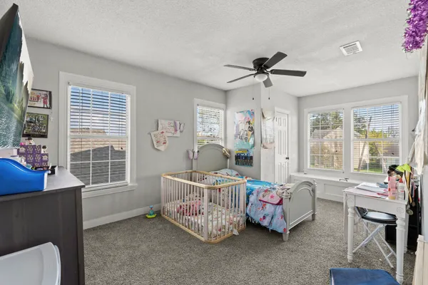 a bed room with furniture and a window