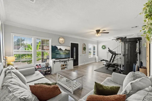 a living room with furniture and a flat screen tv