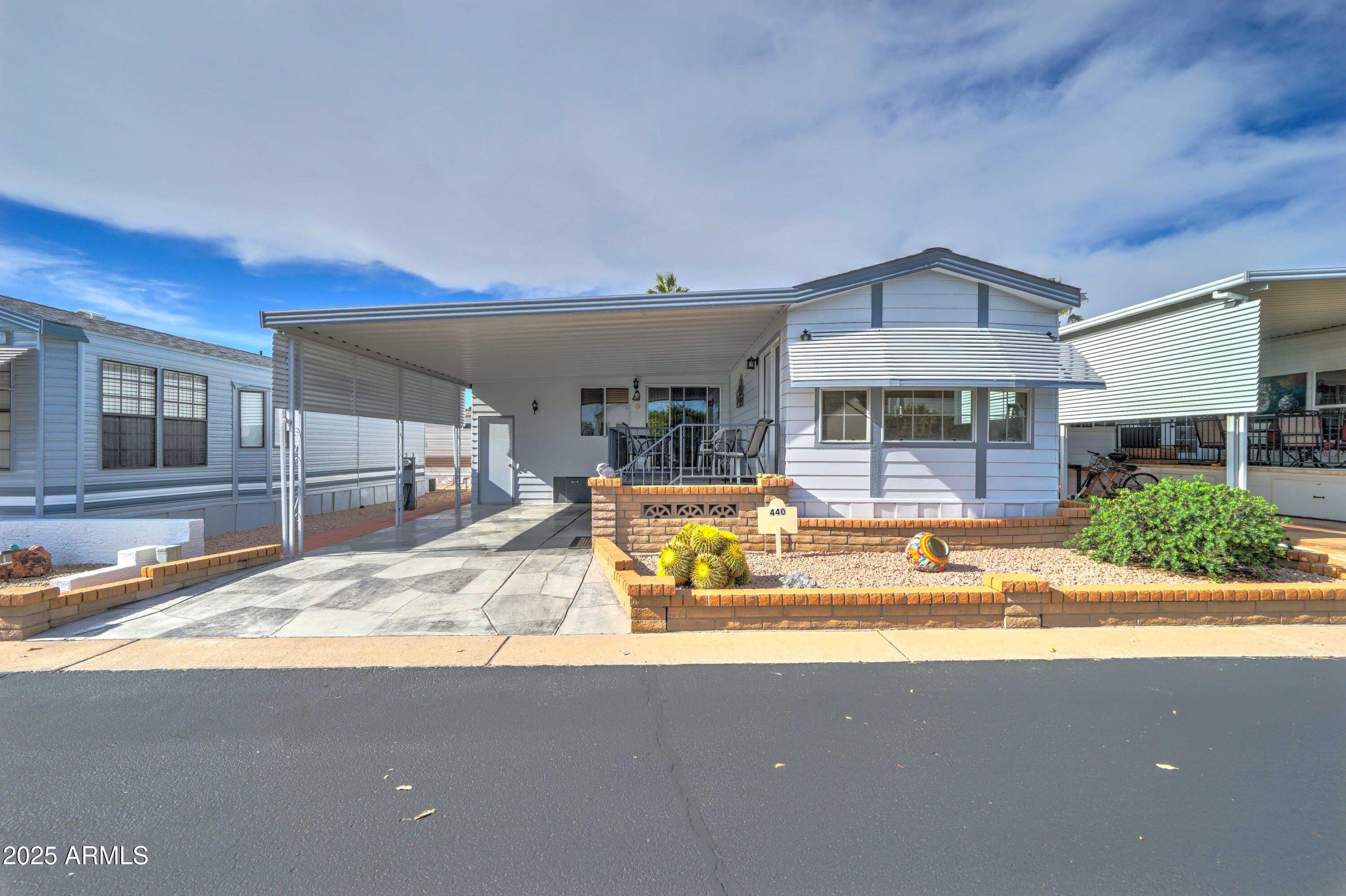 111 South Greenfield Road, Unit 440 Mesa, AZ 85206 - Photo 3 of 31 a view of a house with a swimming pool