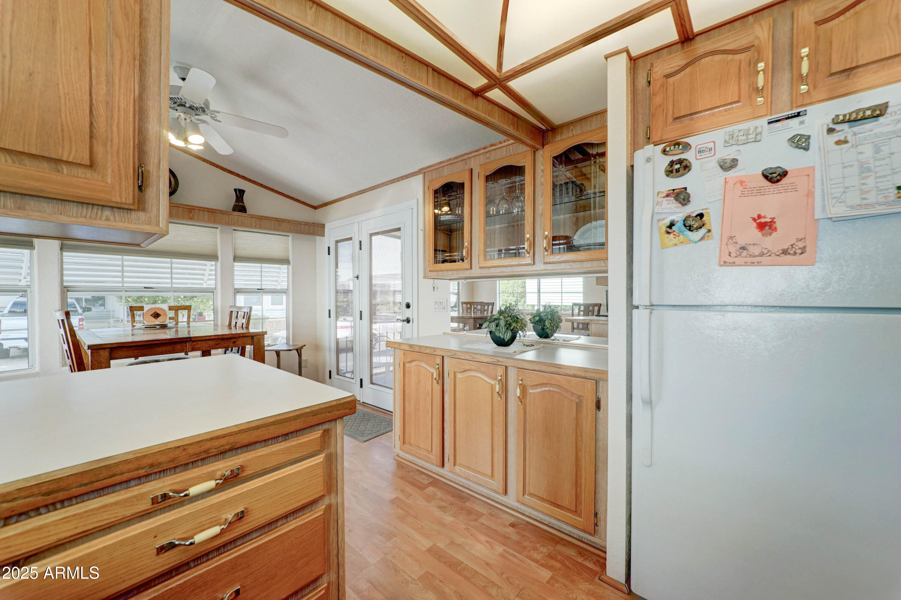 111 South Greenfield Road, Unit 440 Mesa, AZ 85206 - Photo 10 of 31 a kitchen with stainless steel appliances a refrigerator and a stove