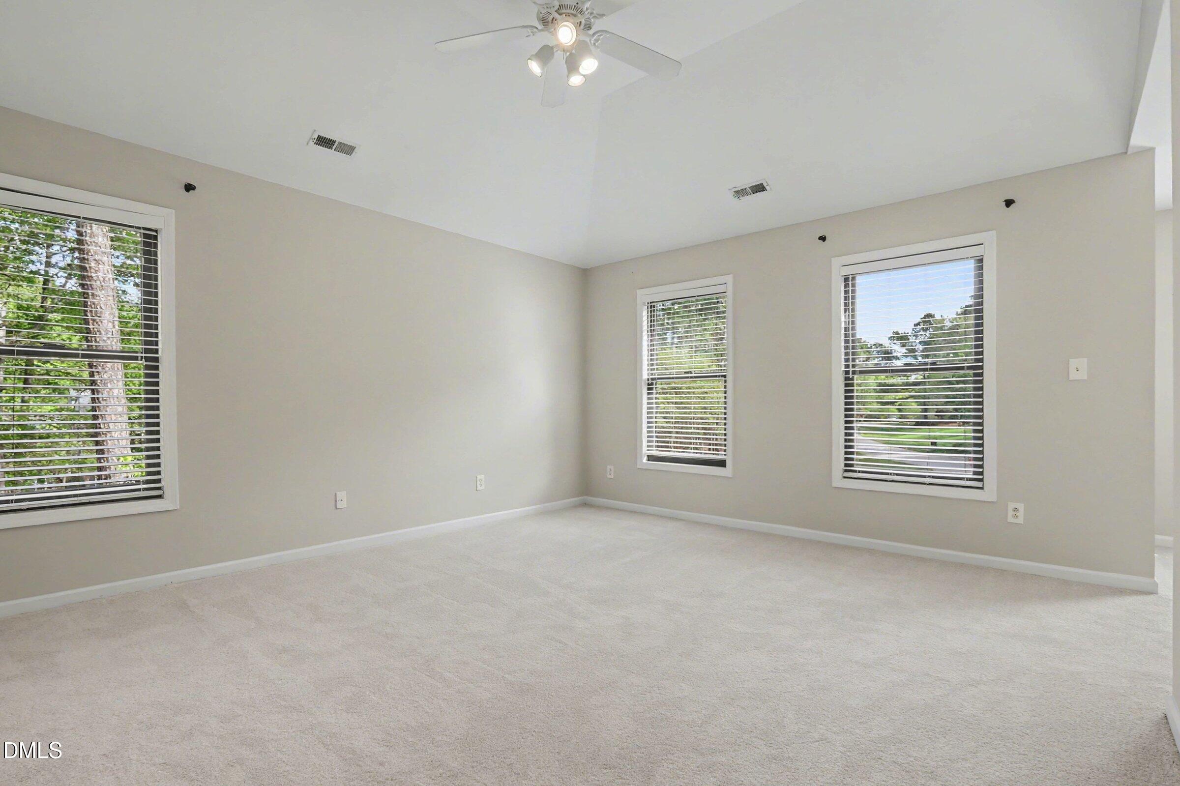 1001 Denfield Court Raleigh, NC 27615 - Photo 24 of 44 a view of an empty room with a window