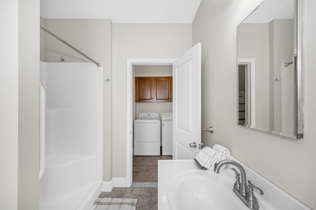 69 Ash Street Reading, MA 01867 - Photo 16 of 29 a bathroom with a sink and a mirror