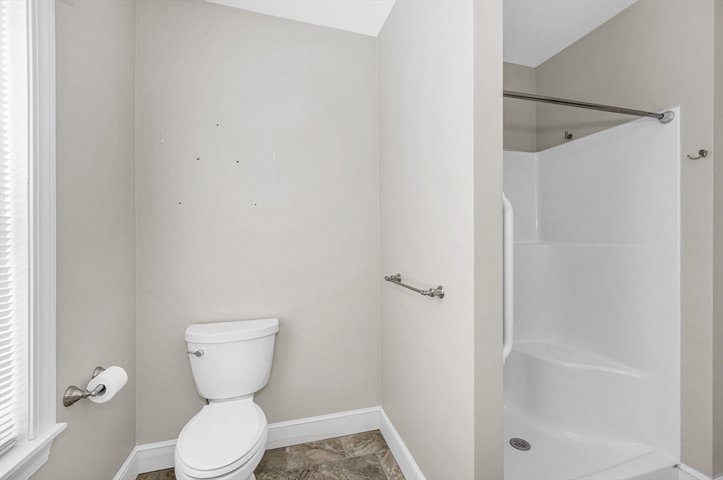 69 Ash Street Reading, MA 01867 - Photo 17 of 29 a bathroom with a toilet and a shower