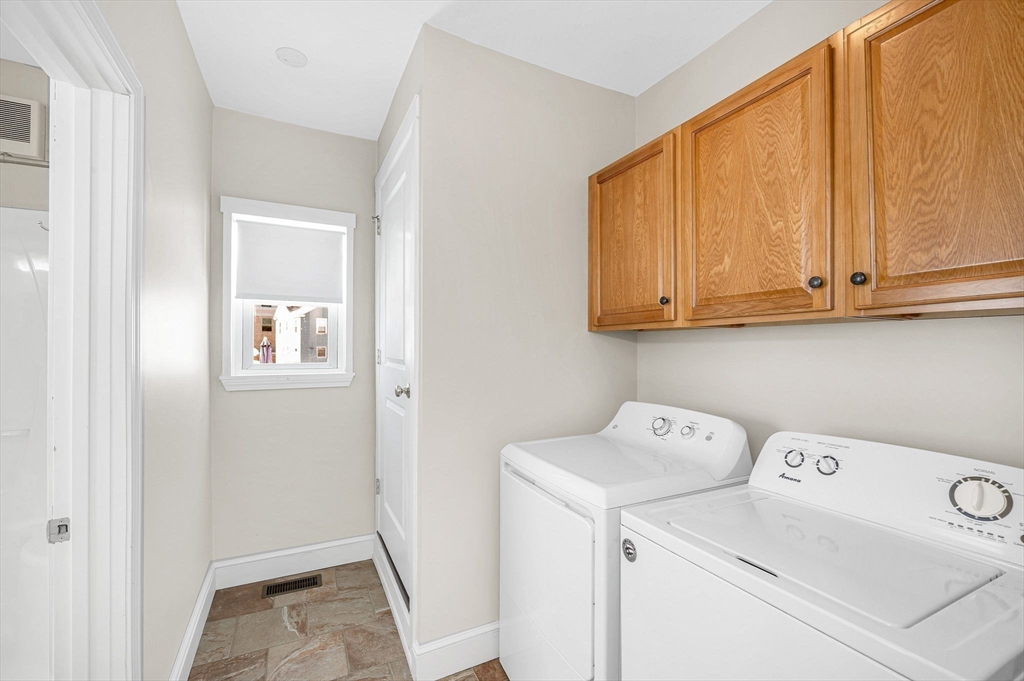 69 Ash Street Reading, MA 01867 - Photo 18 of 29 a utility room with dryer and washer