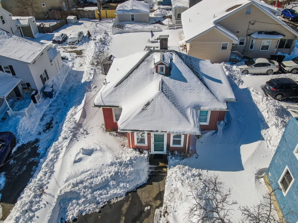 69 Ash Street Reading, MA 01867 - Photo 26 of 29 an aerial view of a house with a yard