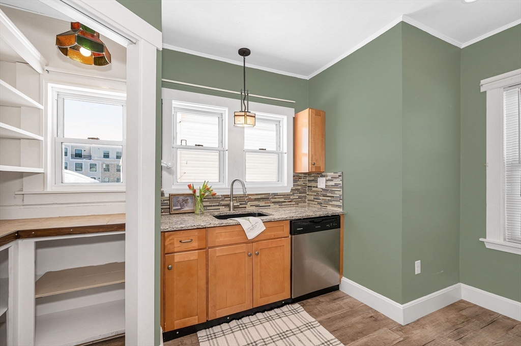 69 Ash Street Reading, MA 01867 - Photo 10 of 29 a bathroom with a granite countertop sink and a mirror