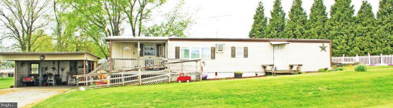 a view of backyard with a garden and deck