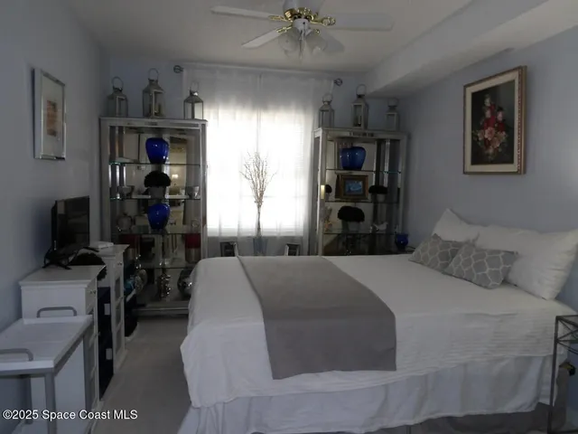 a bed room with a bed and a television