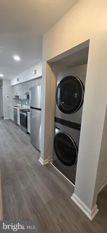 a kitchen with a washer and dryer