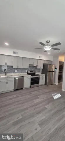 a view of kitchen with wooden floor