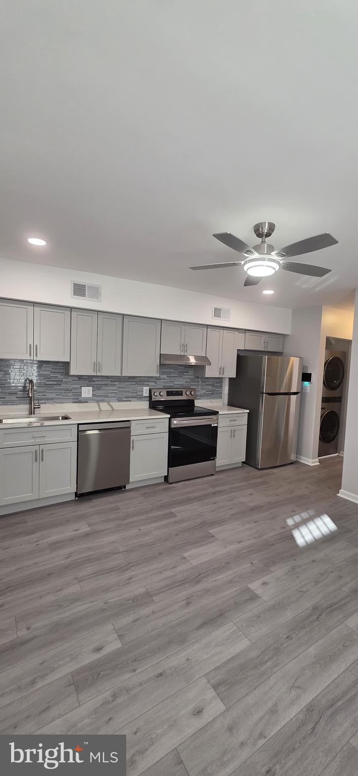 1400 Staples Street Northeast, Unit 1 Washington, DC 20002 - Photo 2 of 13 a view of kitchen with wooden floor