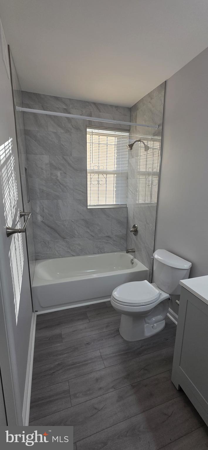 1400 Staples Street Northeast, Unit 1 Washington, DC 20002 - Photo 7 of 13 a bathroom with a toilet and a bath tub