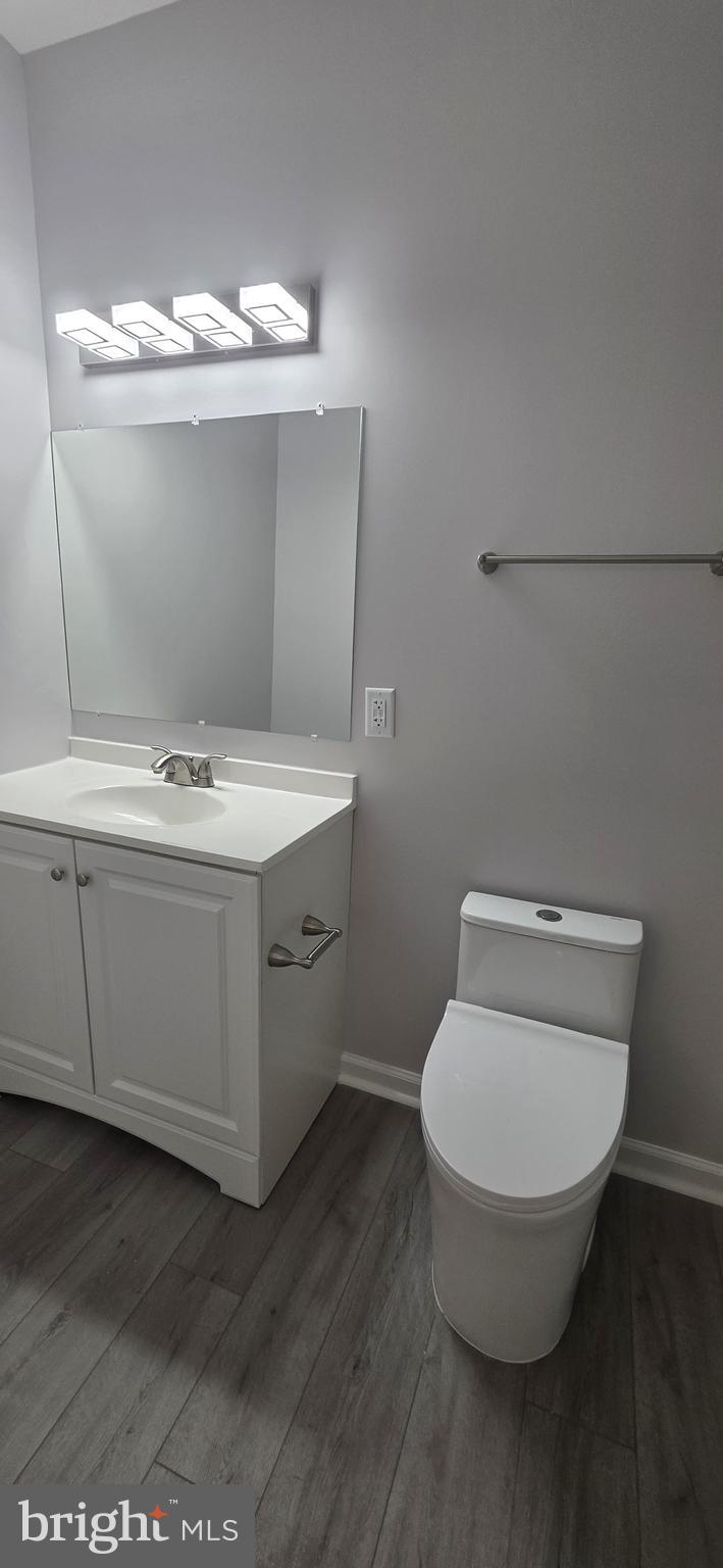 1400 Staples Street Northeast, Unit 1 Washington, DC 20002 - Photo 8 of 13 a bathroom with a toilet sink and mirror