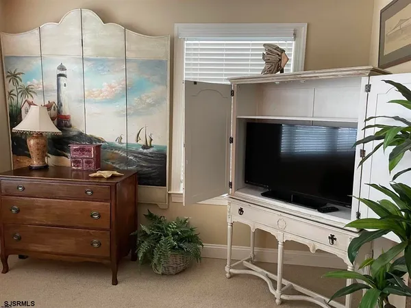 a room with furniture and flat screen tv
