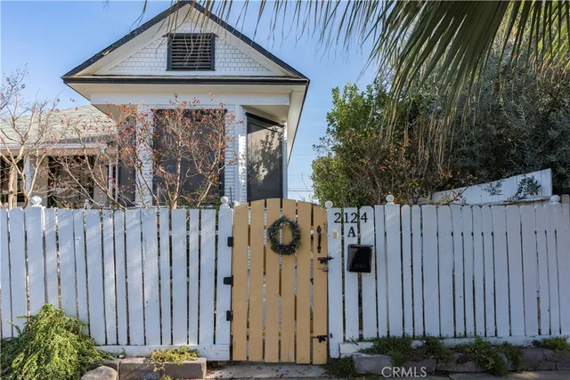 a front view of a building with street sign