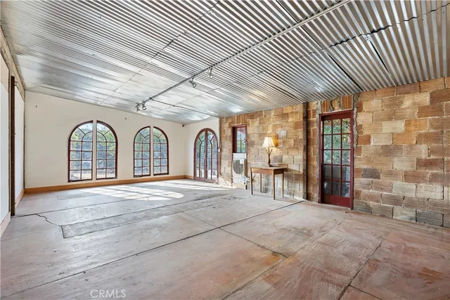 a kitchen with white cabinets and appliances