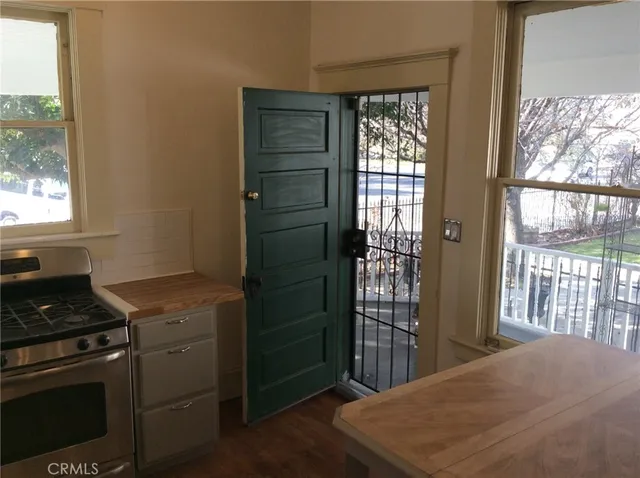 a front view of house with yard outdoor seating and green space