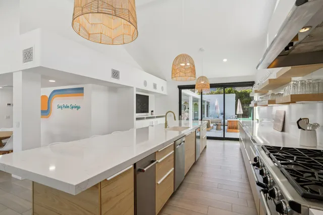 a bedroom with two beds and a desk