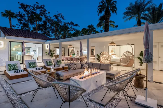 a dining room with furniture and wooden floor