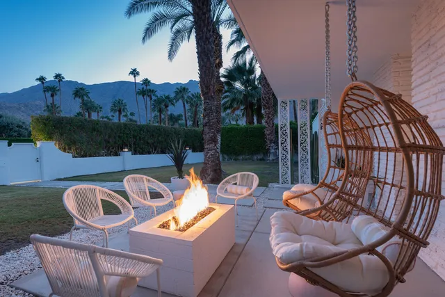 a large kitchen with a table and chairs