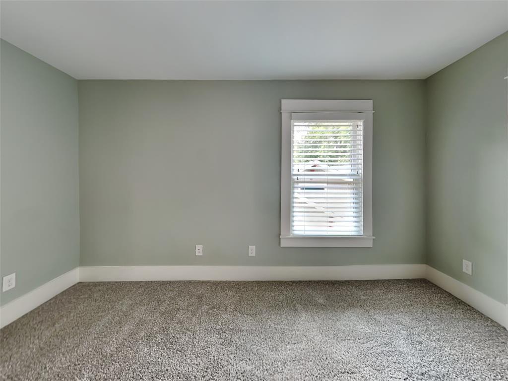 5536 Tremont Street Dallas, TX 75214 - Photo 12 of 21 an empty room with a window